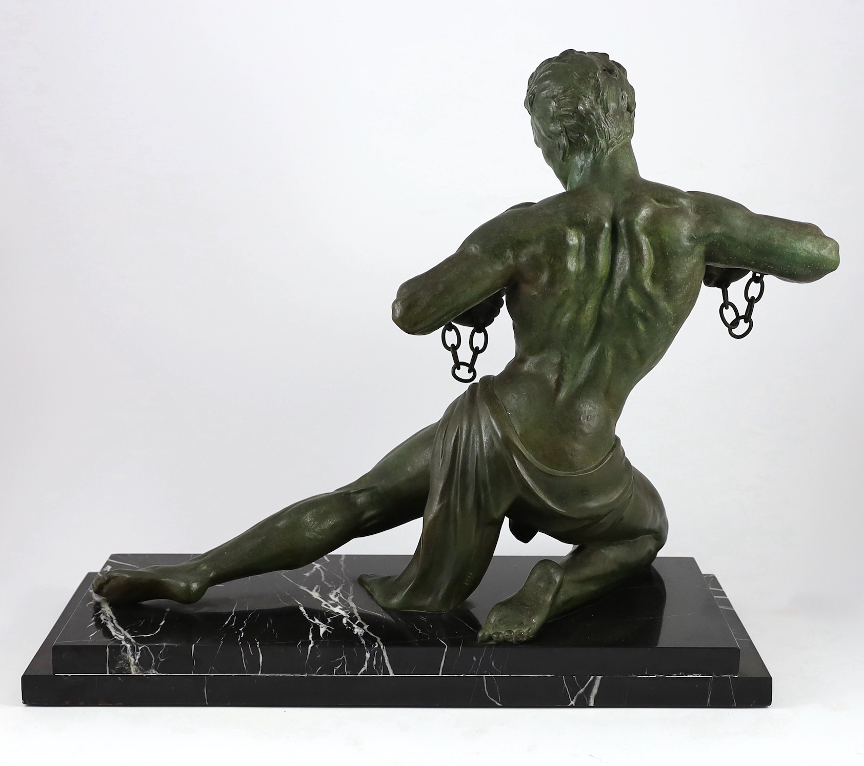Jean De Roncourt. A French Art Deco bronze 'Hercule brisant ses chaînes', 50cm high 61cm long